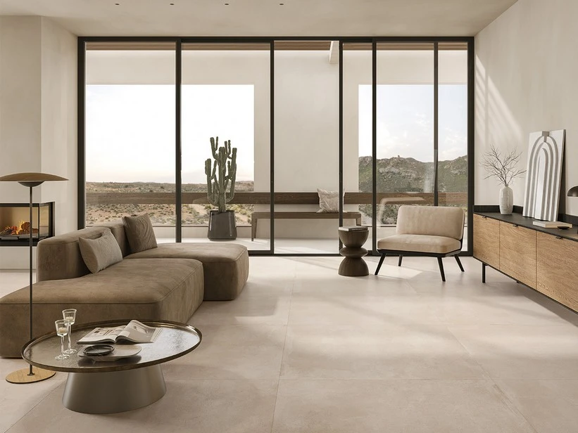 Large-format sand-colored porcelain tile in a modern living room