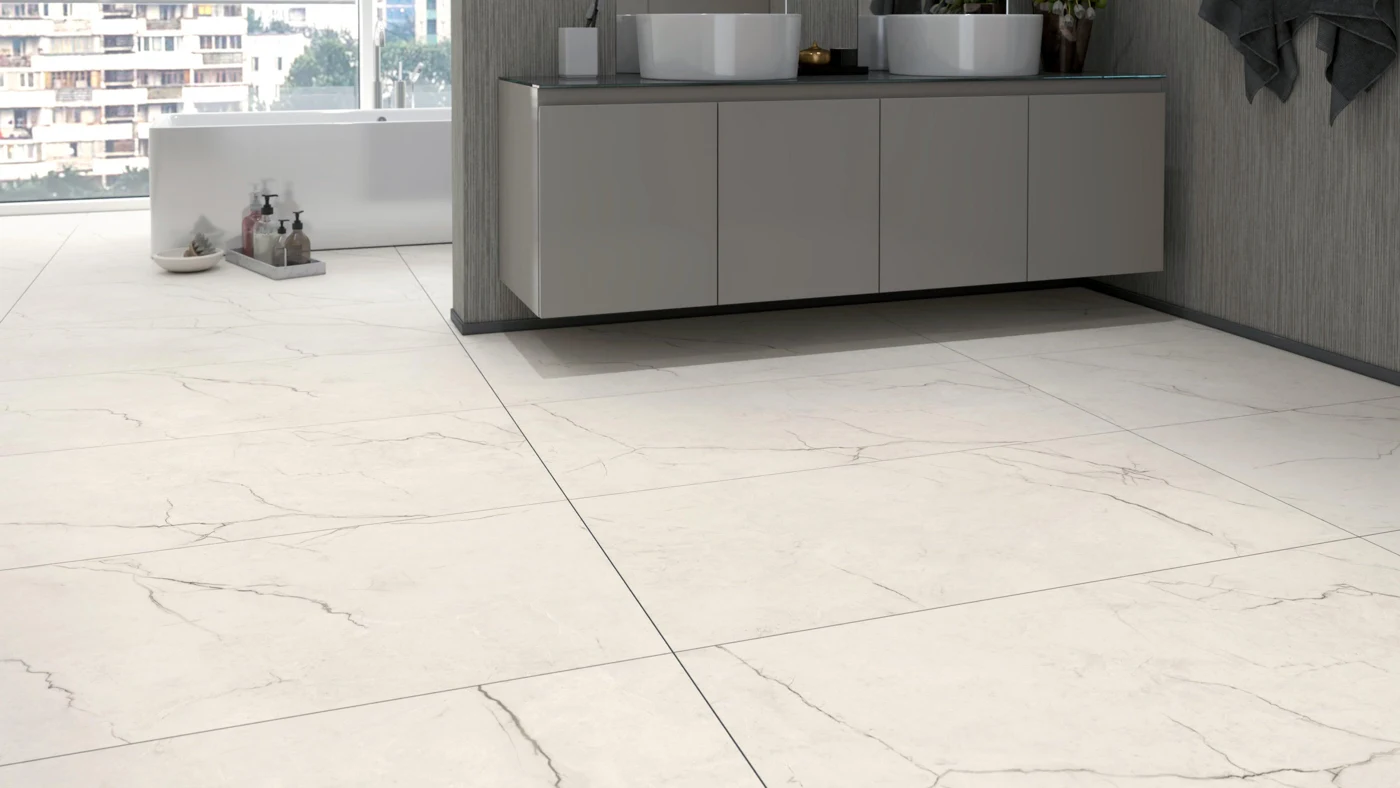 Large ivory porcelain floor tiles with subtle marble-look veining in a modern bathroom